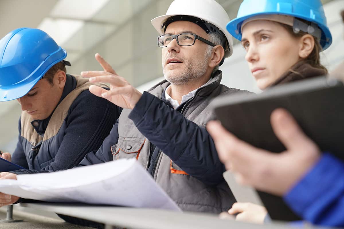 Instructor with young people in engineering training