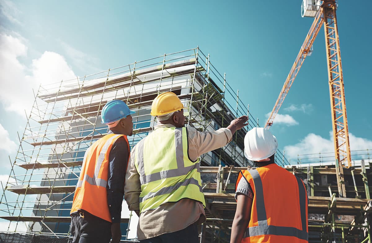 Engineering, construction site and team outdoor for building project.