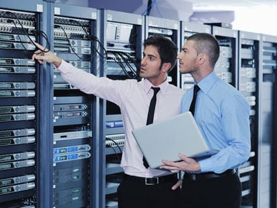Two men troubleshooting server box
